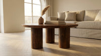 36 In. Dark Brown round Wood Scandinavian Coffee Table with Cylindrical Legs — Lifestyle